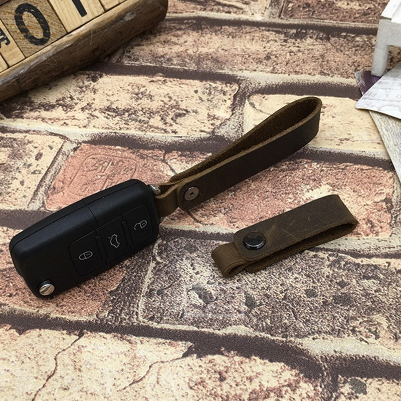 Cordón hecho a mano, llavero de coche, cordones de cuero de vaca, colgante de teléfono de cuero de Caballo Loco Retro, accesorios universales para llavero