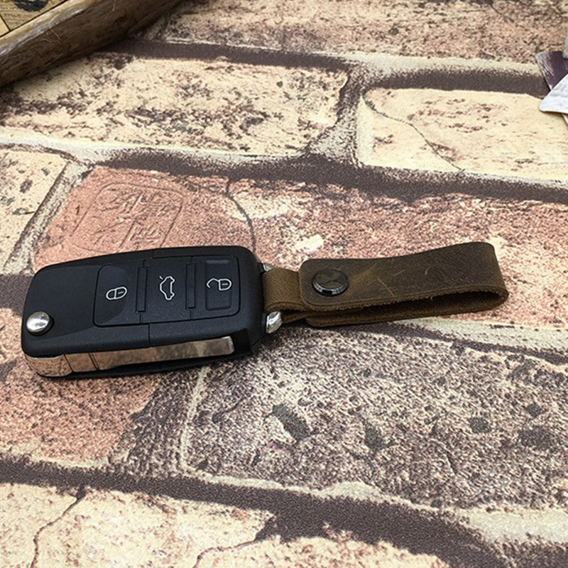 Cordón hecho a mano, llavero de coche, cordones de cuero de vaca, colgante de teléfono de cuero de Caballo Loco Retro, accesorios universales para llavero