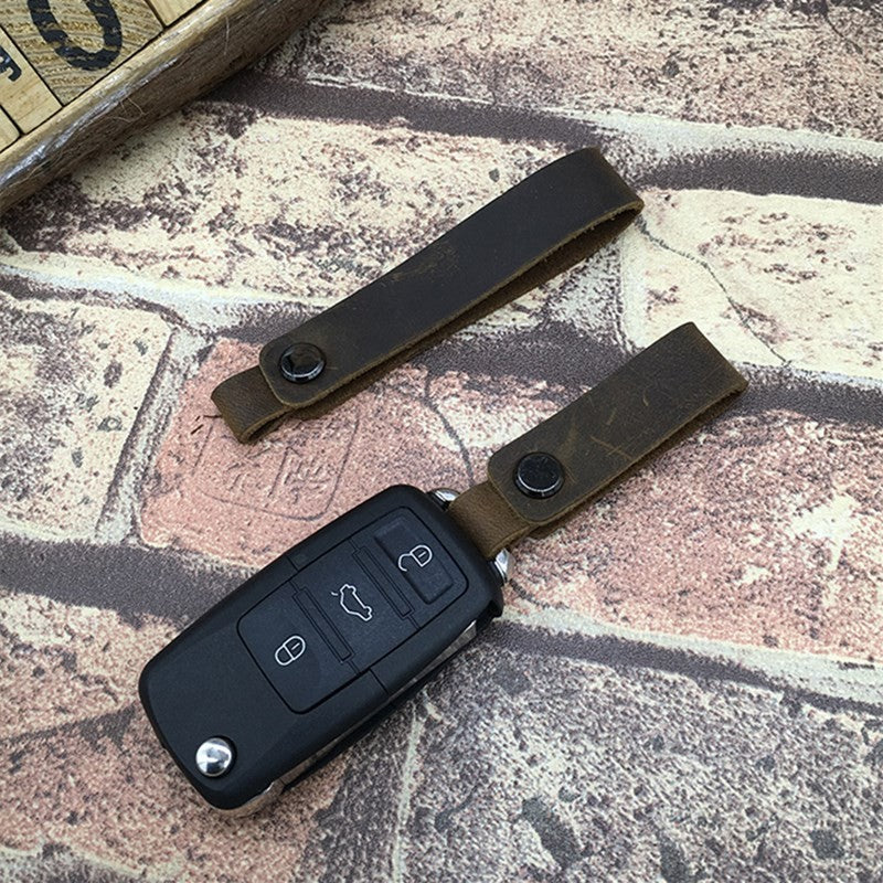 Cordón hecho a mano, llavero de coche, cordones de cuero de vaca, colgante de teléfono de cuero de Caballo Loco Retro, accesorios universales para llavero
